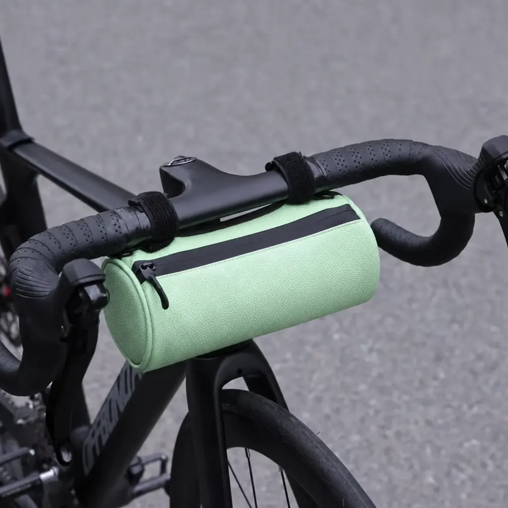 Ridgeline Roll barrel handlebar bag in green mounted on drop handlebars